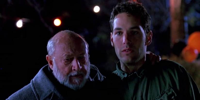 Dr. Loomis puts his arm around Tommy, who looks shell-shocked in 'Halloween: The Curse of Michael Myers'