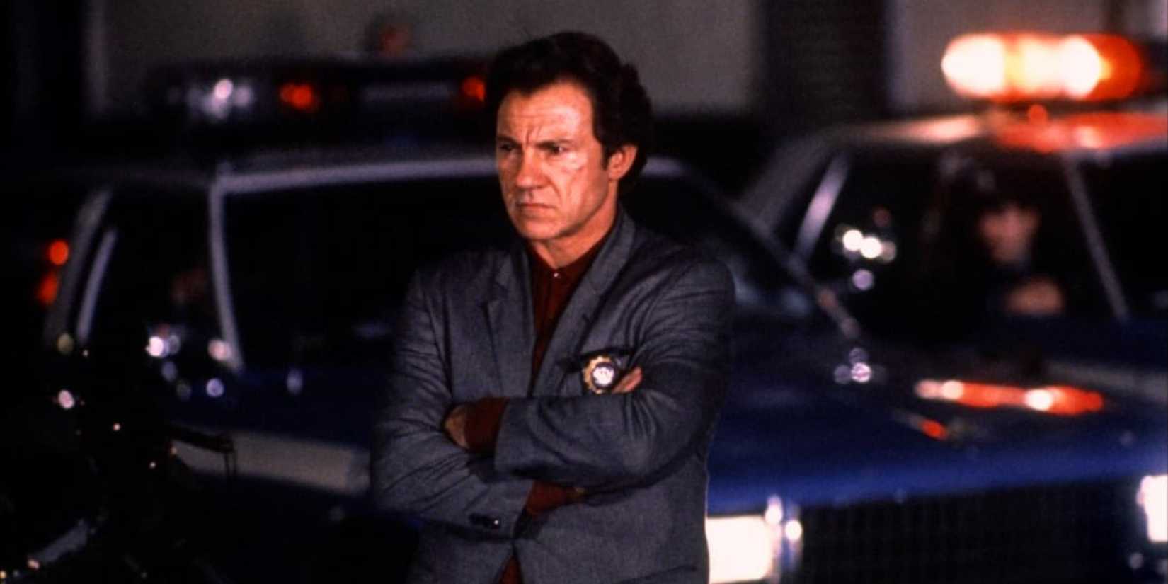 Harvey Keitel with arms folded looking cross in Bad Lieutenant.