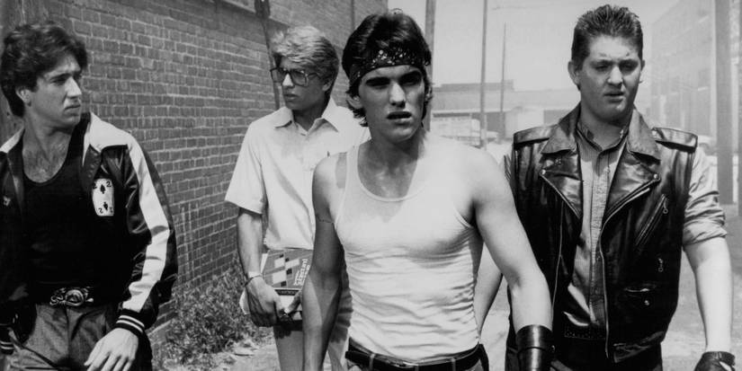 Nicolas Cage, Matt Dillon, and Chris Penn walking together in Rumble Fish