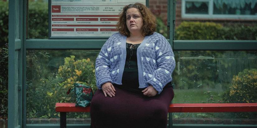 Jessica Gunning as Martha, sitting and crying at a bus stop in Baby Reindeer.