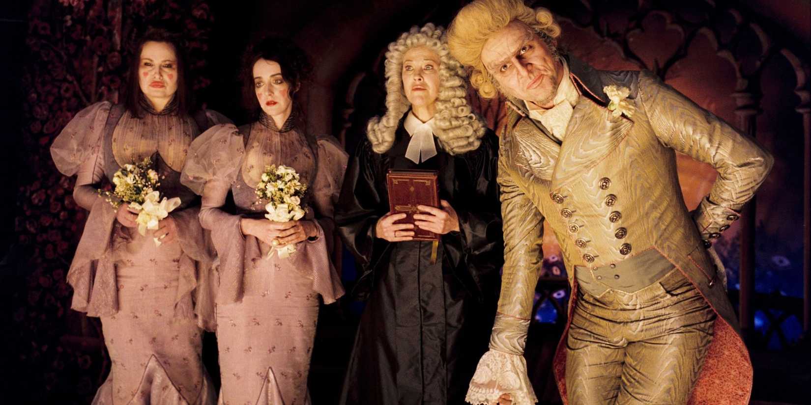 Jim Carrey, Catherine O'Hara, Jane Adams, and Jennifer Coolidge on a stage in A Series of Unfortunate Events.