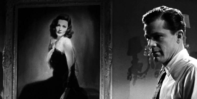 Marc McPherson (Dana Andrews) standing in profile in front of Laura Hunt's (Gene Tierney) portrait on the wall in Laura