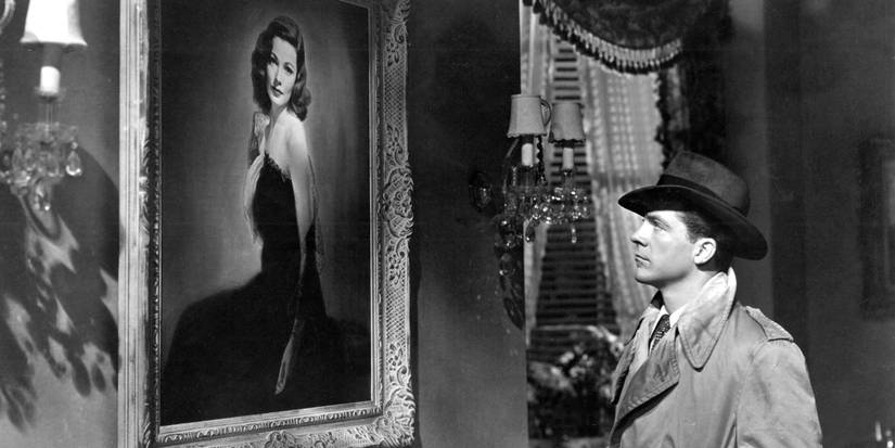 Marc McPherson (Dana Andrews) staring longingly up at a portrait of Laura Hunt (Gene Tierney) on her wall in Laura