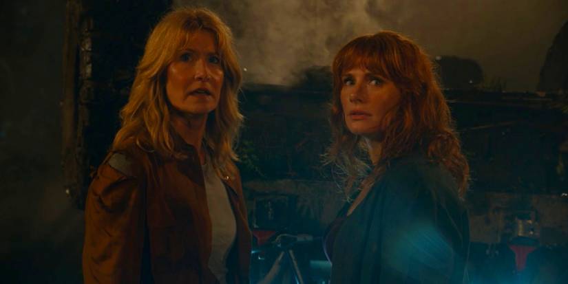Laura Dern and Bryce Dallas Howard standing together looking alarmed in Jurassic World Dominion
