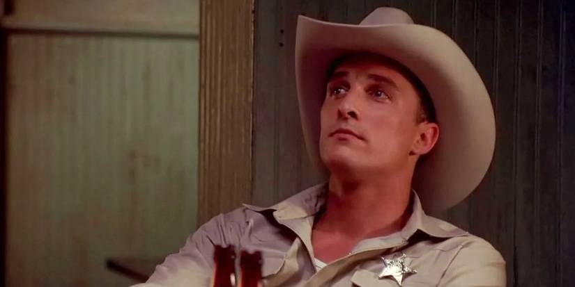 Matthew McConaughey as Buddy Deeds looking at a person offscreen in Lone Star