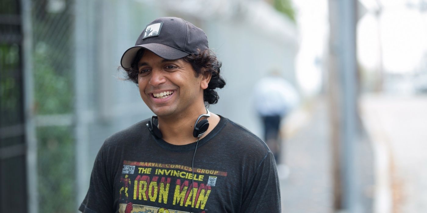 Director M. Night Shymalan smiles in the sunshine in a behind-the-scenes photo from the set of Split