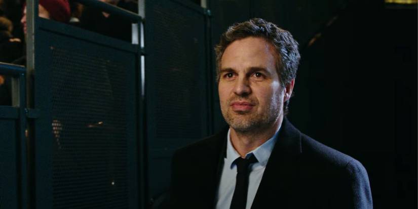 Mark Ruffalo standing beside the bleachers, giving a slight smile, as Dylan Rhodes in Now You See Me 2.