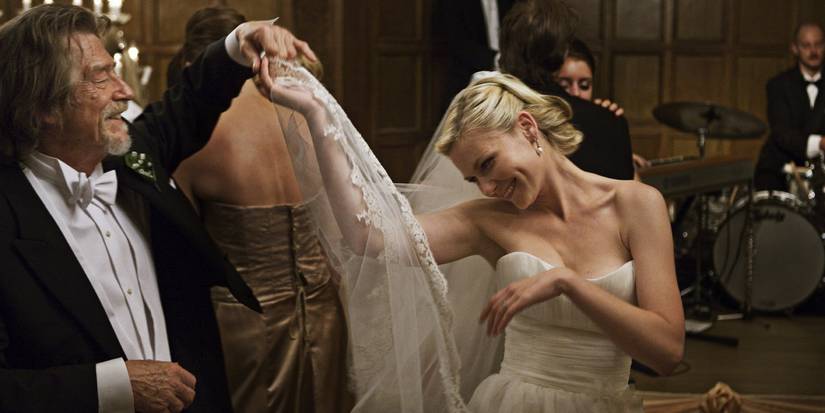 Justine (Kirsten Dunst) dancing with her dad (John Hurt) at the wedding reception in Melancholia