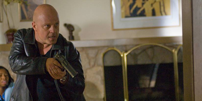 Michael Chiklis as Vic Mackey in a house with a gun in 'Family Meeting' from 'The Shield'