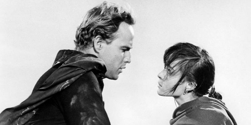 Marlon Brando as Rio and Pina Pellicer as Louisa looking into each other's eyes in One-Eyed Jacks