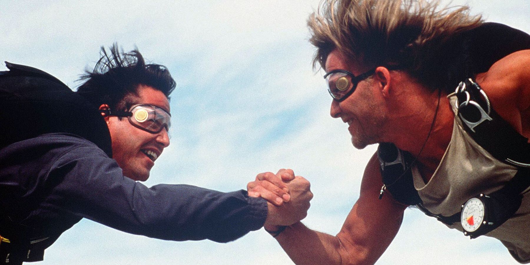 Bodhi and Johnny clasp hands while skydiving in &lsquo;Point Break&rsquo;