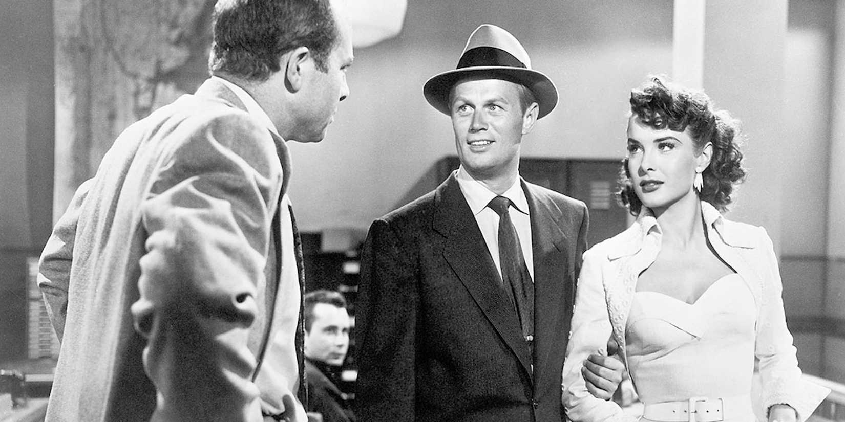 A man talking to a couple in Pickup on South Street 10