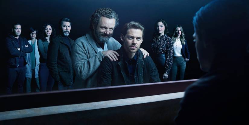 The cast of 'Prodigal Son' is reflected in a mirror as Malcolm looks on.