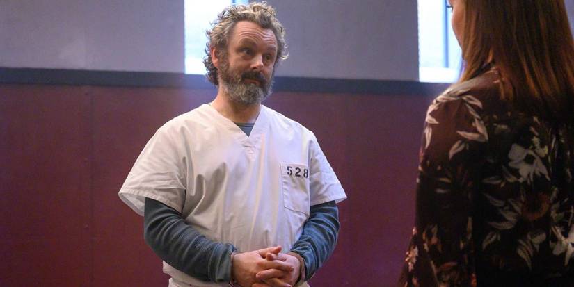 Martin stands with his hands in chains with Jessica in 'Prodigal Son.'