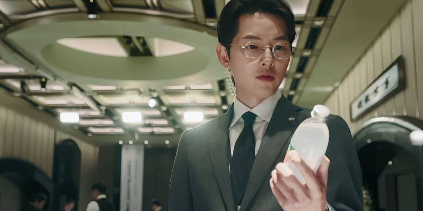 Song Joong-ki as Jin Do-jun holding bottle in Reborn Rich