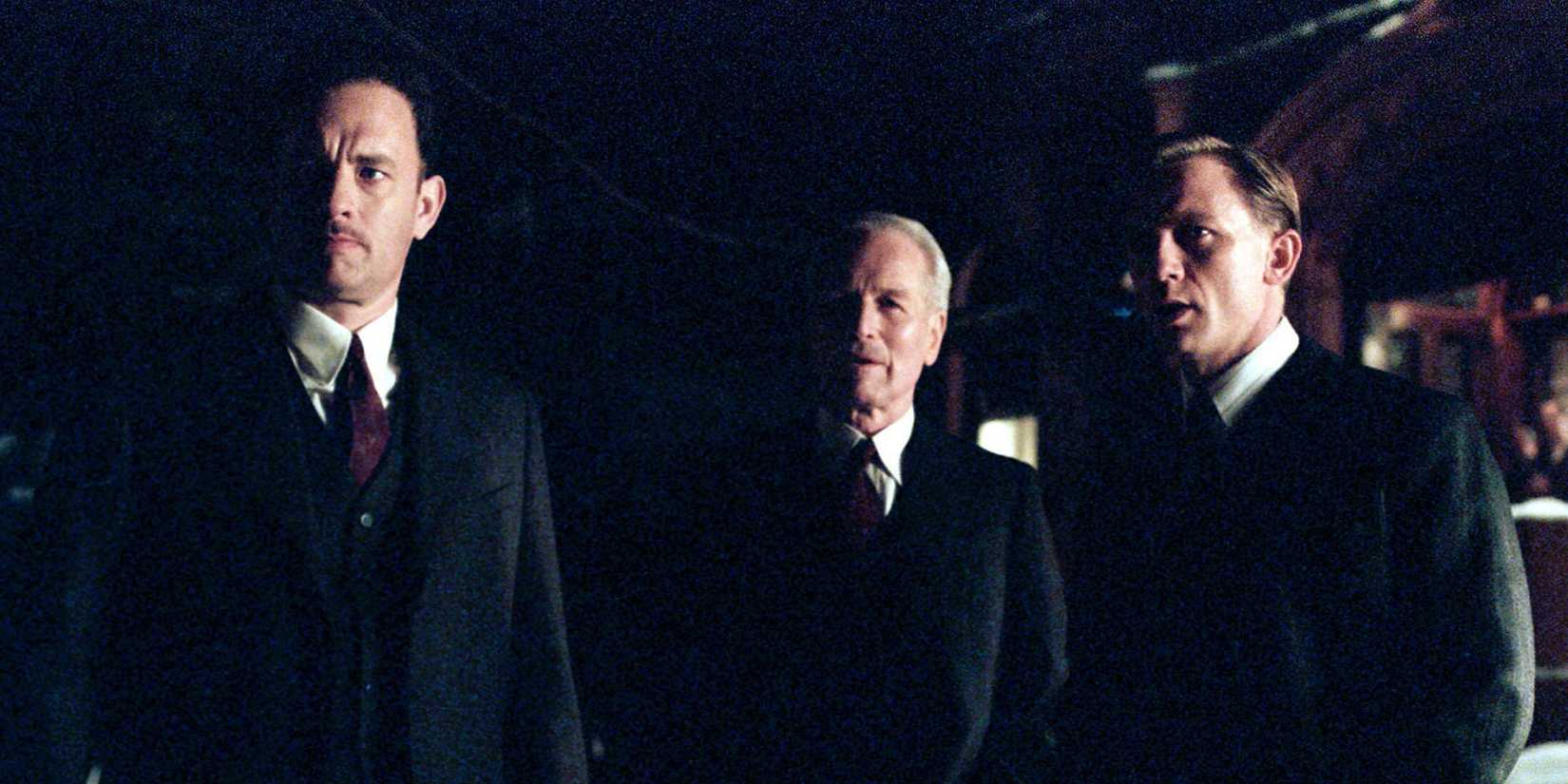 Michael Sullivan (Tom Hanks), John Rooney (Paul Newman), and Connor Rooney (Daniel Craig) in private conversation in Road to Perdition
