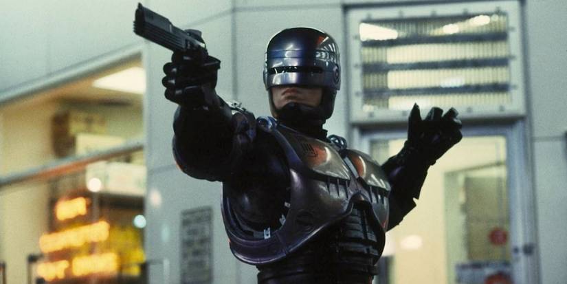 RoboCop (Peter Weller) aims his gun in 'RoboCop'