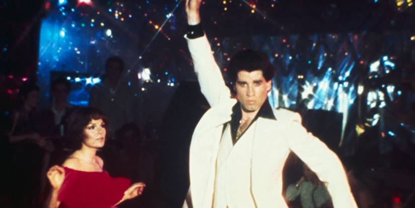 John Travola and Karen Lynn Gorner on dance floor as Tony and Stephanie wearing white suit and red dress in 'Saturday Night Fever'