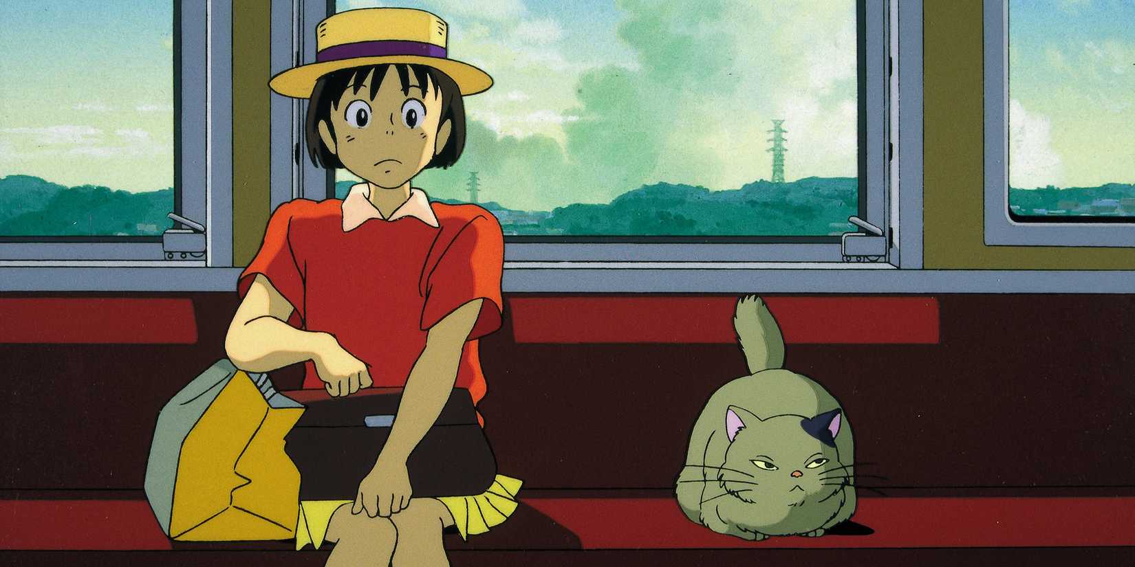 Shizuku and a cat on the train in 'Whisper of the Heart'.