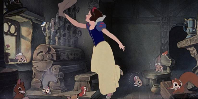 Snow White give the dwarf's home a thorough cleaning in 'Snow White and the Seven Dwarfs'