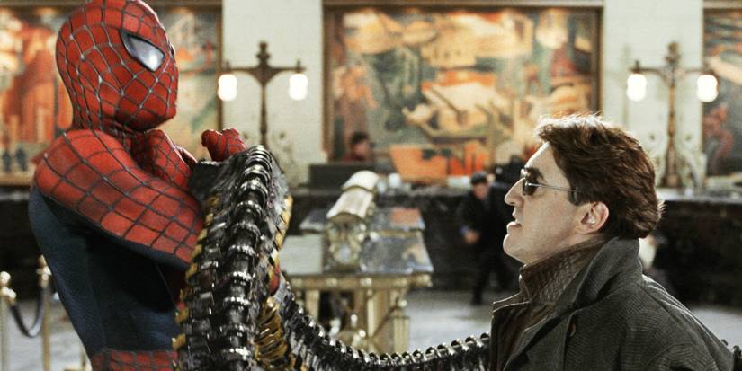 Alfred Molina's Doc Ock holding up Tobey Maguire's Spider-Man in Spider-Man 2