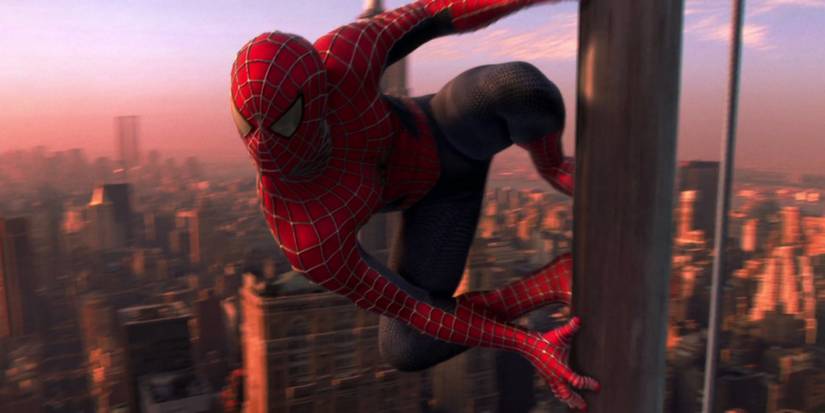 Spider-Man atop a building with New York City in the background in Spider-Man, 2002.