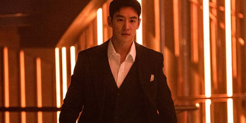 A young man in a suit walking down a hallway in Taxi Driver 3