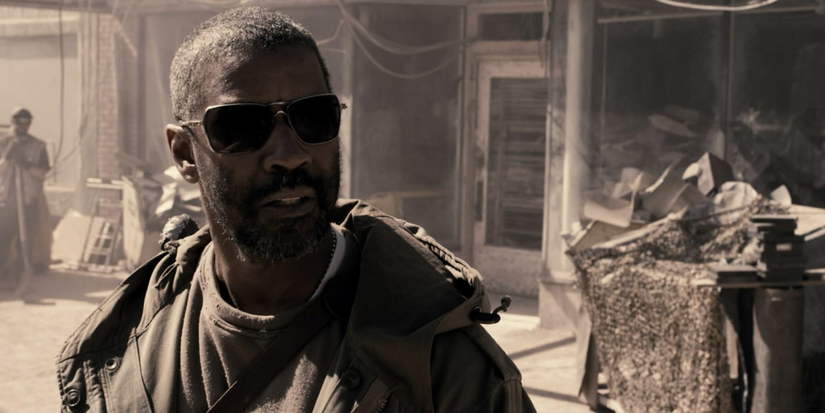 Eli looks off camera with his sun shades on in The Book of Eli.