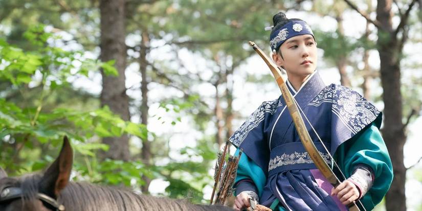 A still from the Netflix K-Drama The King's Affection of a person on horseback with a bow and arrows. 