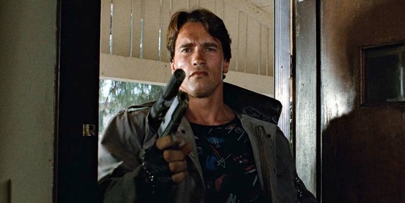 The Terminator, played by Arnold Schwarzenegger, holds a gun in 'The Terminator'.