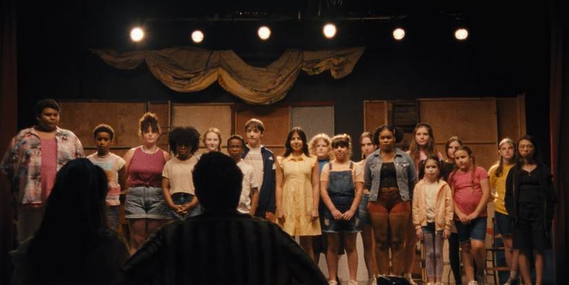 The Cast of Theater Camp performing on stage