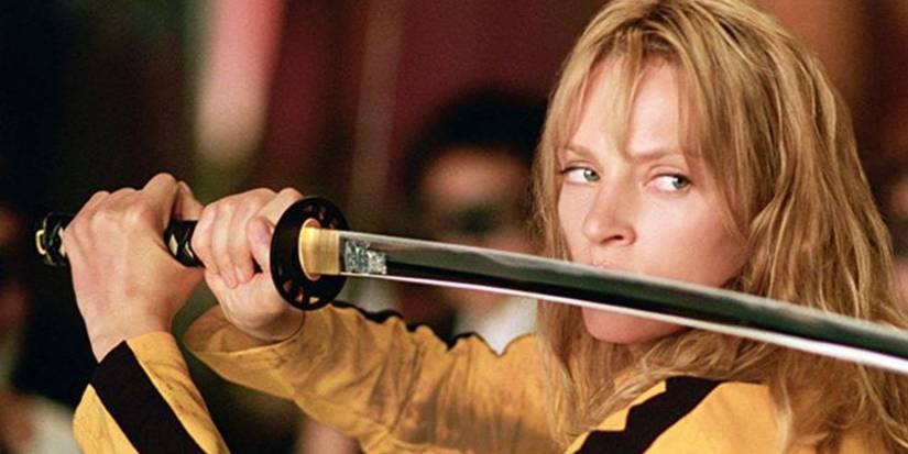 Uma Thurman as the bride, holding her katana defensively across her face in Kill Bill.