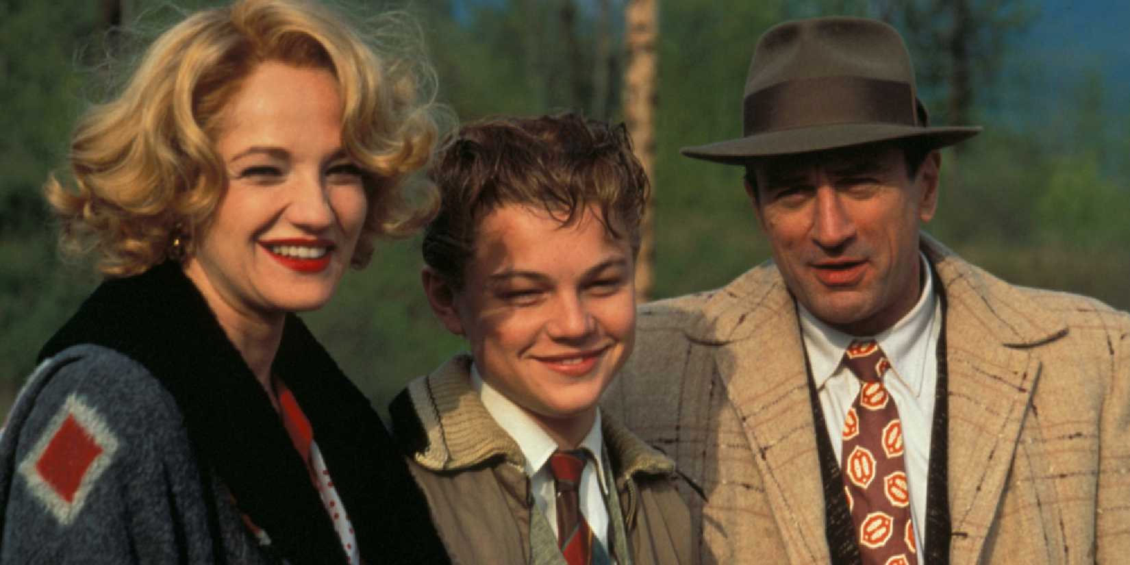 The cast of This Boy's Life with Leonardo DiCaprio and Robert De Niro smiling at the camera.