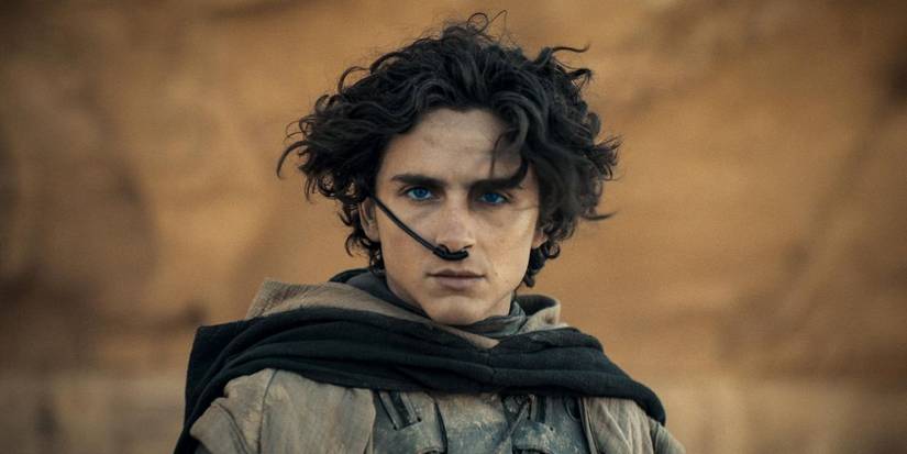 Timothée Chalamet as Paul Atreides in the desert with an apparatus up his nose in Dune: Part Two.
