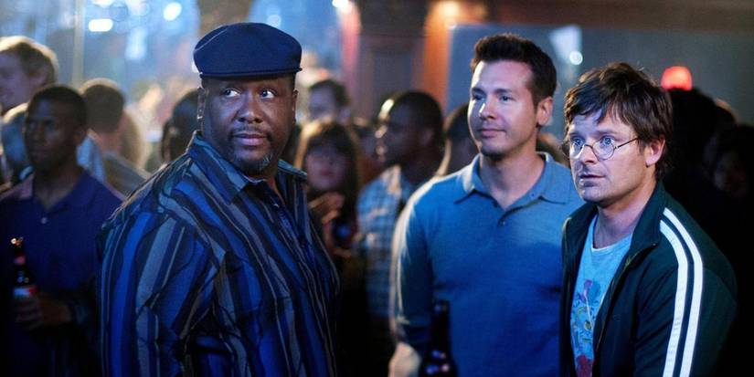 There men in a crowded venue, all dressed differently in a scene from Treme.