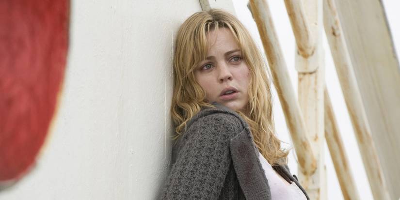 Melissa George looking frightened while leaning on a ship wall in Triangle