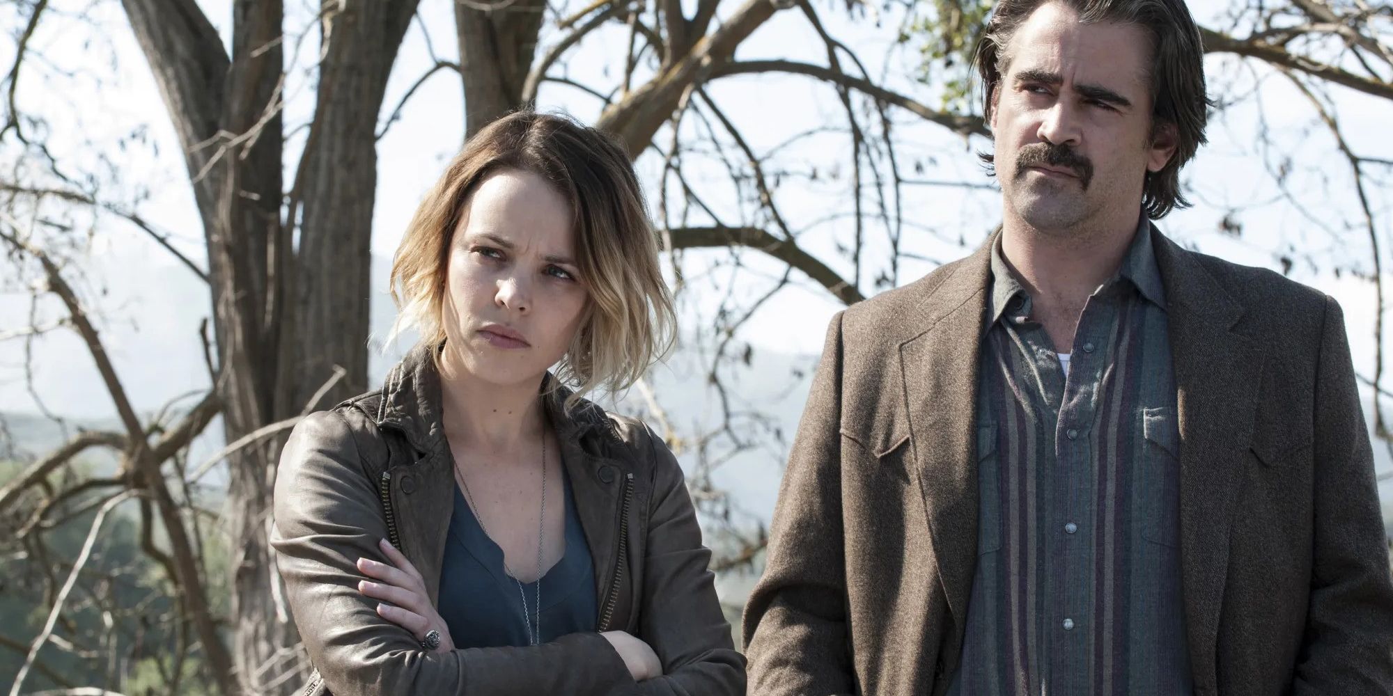 Rachel McAdams and Colin Farrell standing outside by trees in True Detective Season 2, Episode 10.