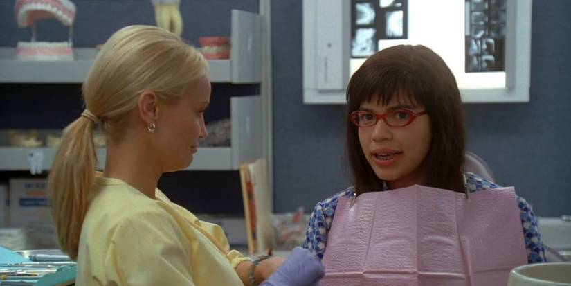 Betty's dentist gets ready to look at her teeth.