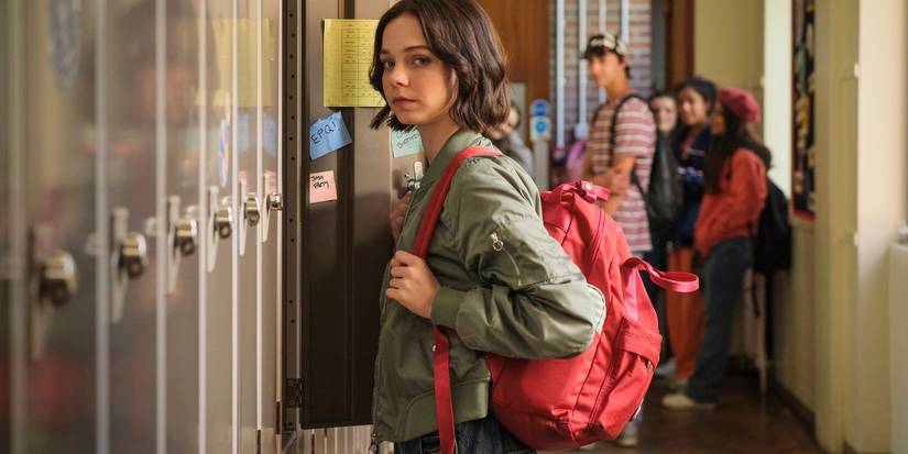 Emma Myers stares at the camera in a high school hallway in A Good Girls Guide to Murder.