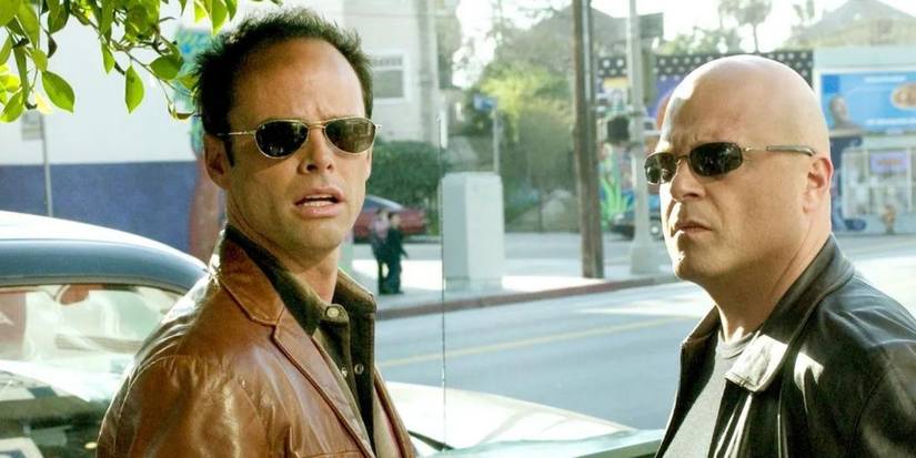 Walton Goggins and Michael Chiklis looking at someone off screen in The Shield