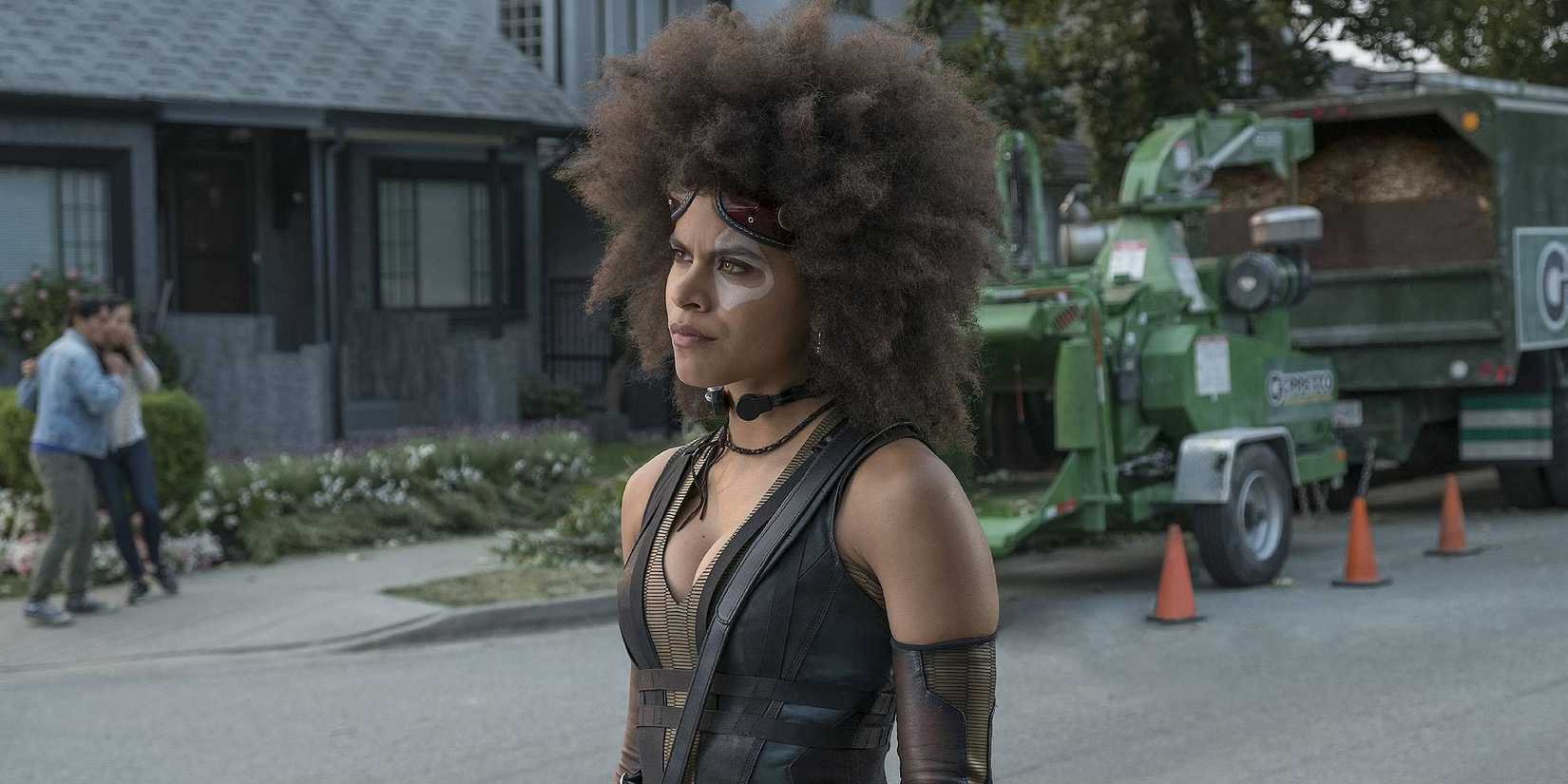 Zazie Beetz as Domino in Deadpool 2 standing in the middle of the street looking befuddled. 