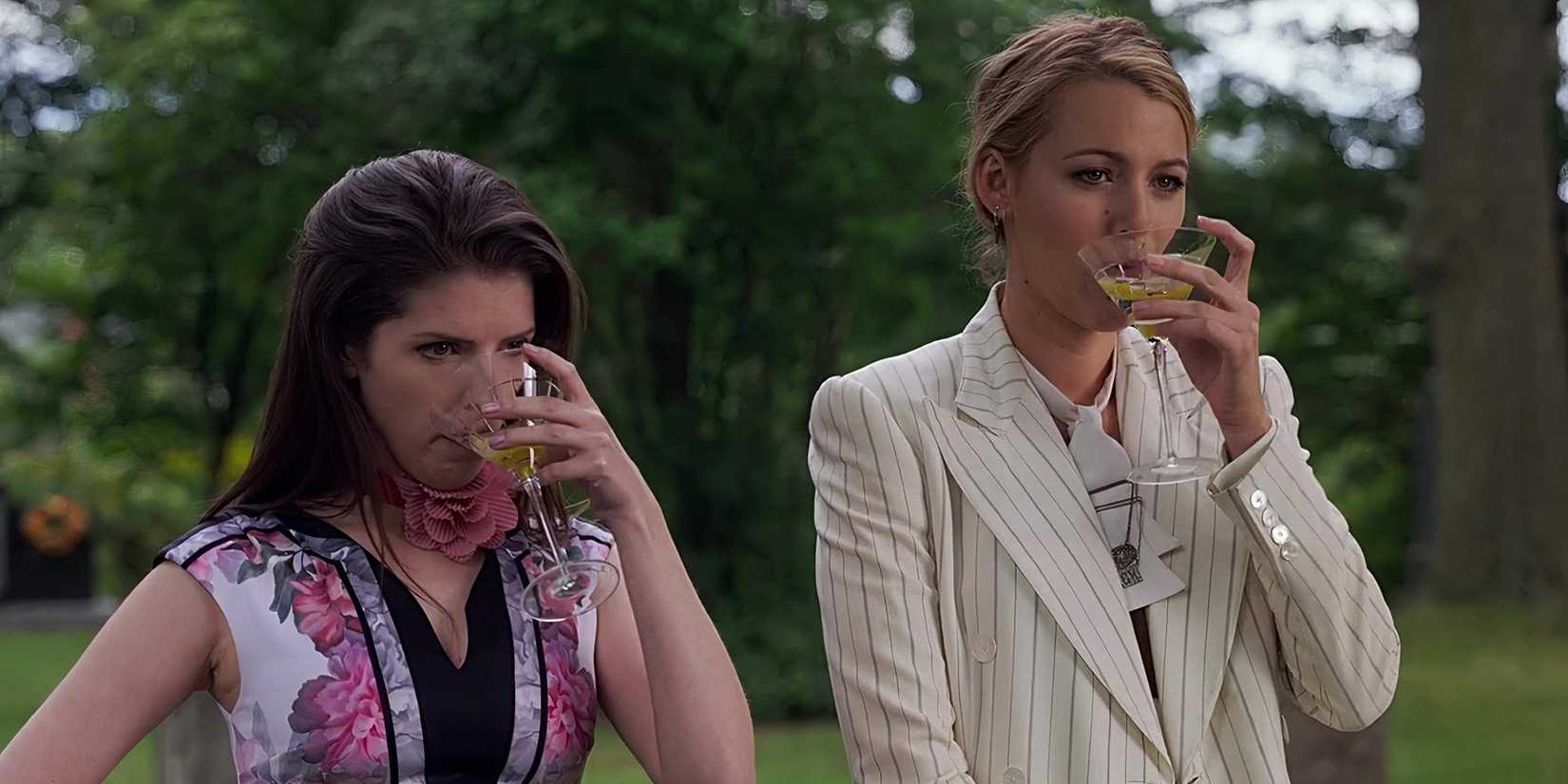 Anna Kendrick as Stephanie and Blake Lively as Emily drinking martinis in A Simple Favor