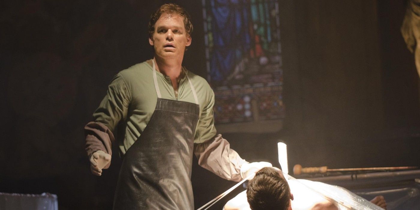 Dexter stands like a deer in the headlights holding a knife over a dead body in Dexter.