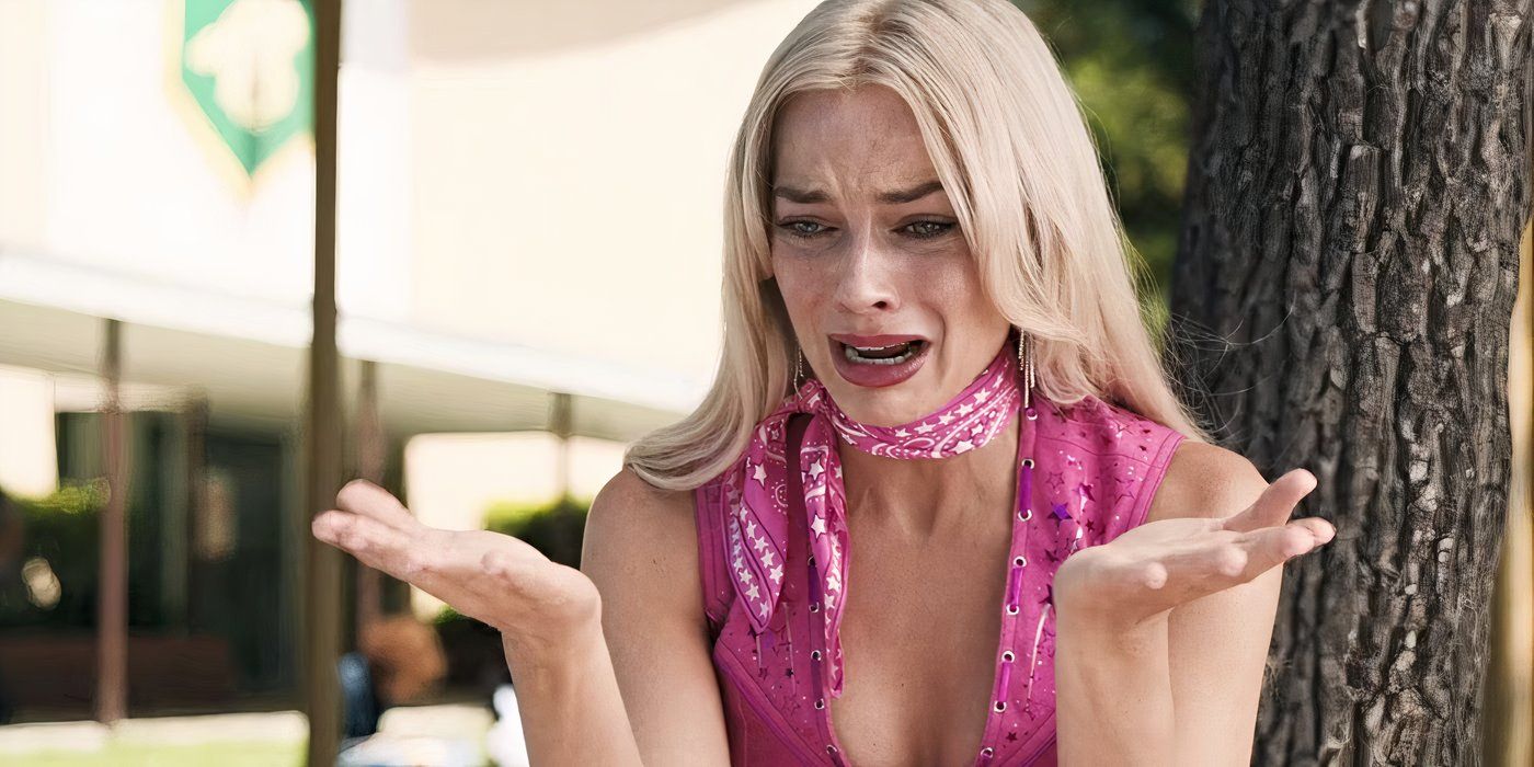 Margot Robbie as Barbie crying outside, wearing a pink Western jumpsuit in Barbie.