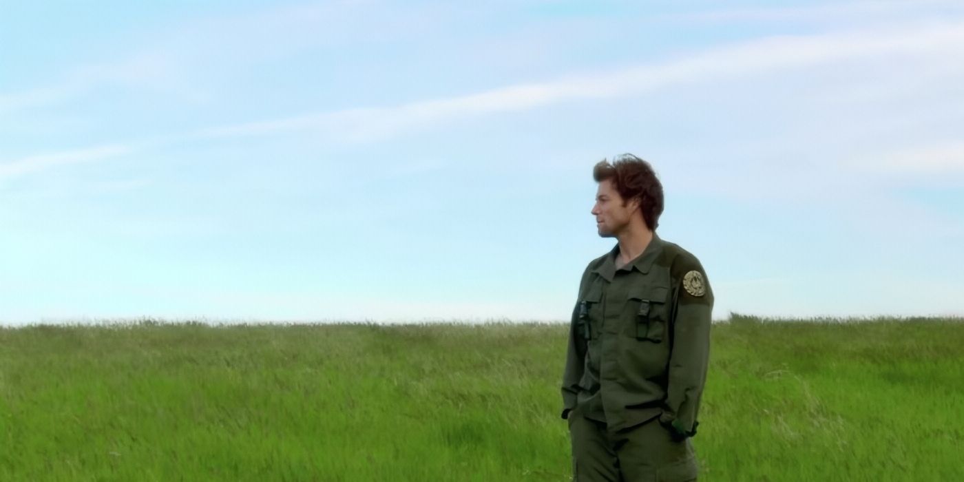 An image from the last episode of Battlestar Galactica, with a man standing in an empty field of grass