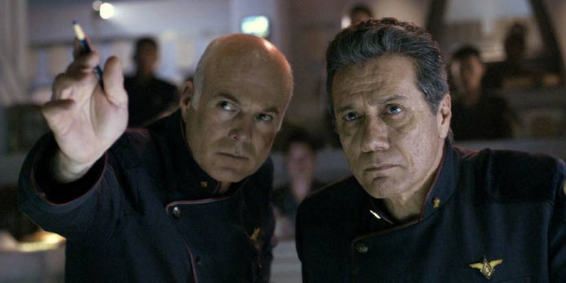 Michael Hogan showing Edward James Olmos something in the control room in Battlestar Galactica