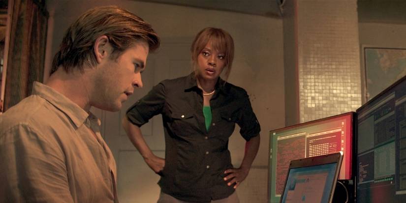Viola Davis as FBI Special Agent Carol Barrett looking at Chris Hemsworth as Nicholas Hathaway in Blackhat