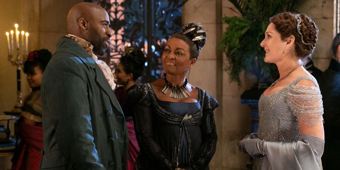 Daniel Francis, Adjoa Andoh, and Ruth Gemmell at a ball in Bridgerton Season 3 Episode 3