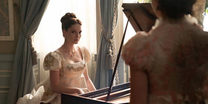 Hannah Dodd as Francesca Bridgerton sitting at a piano in Bridgerton Season 3 Episode 1