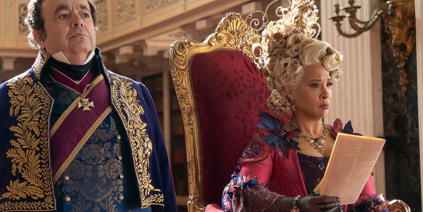 Golda Rosheuvel holding a copy of Lady Whistledown with Hugh Saachs beside her in Bridgerton Season 3.